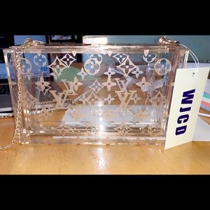 Clear handbag with gold accents